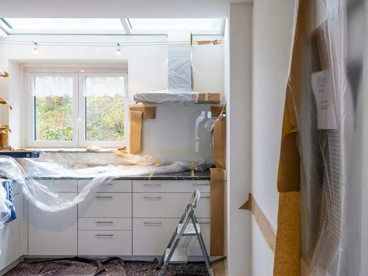 Before: the old kitchen under plastic sheeting